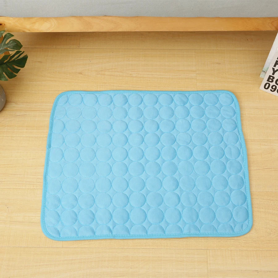 Blue quilted pet cooling mat viewed from above