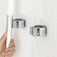 Thumbnail for Compact adhesive holder organizing a handled cleaning tool