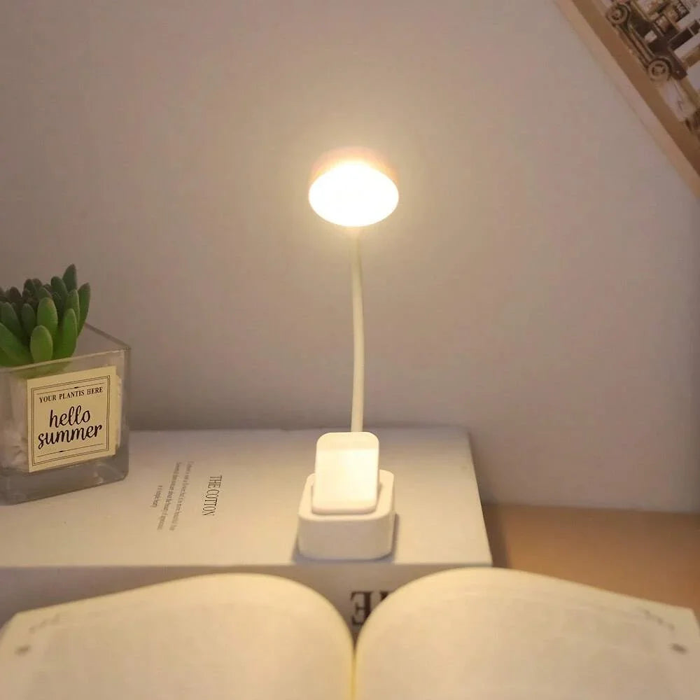 White clip-on lamp – reading use example