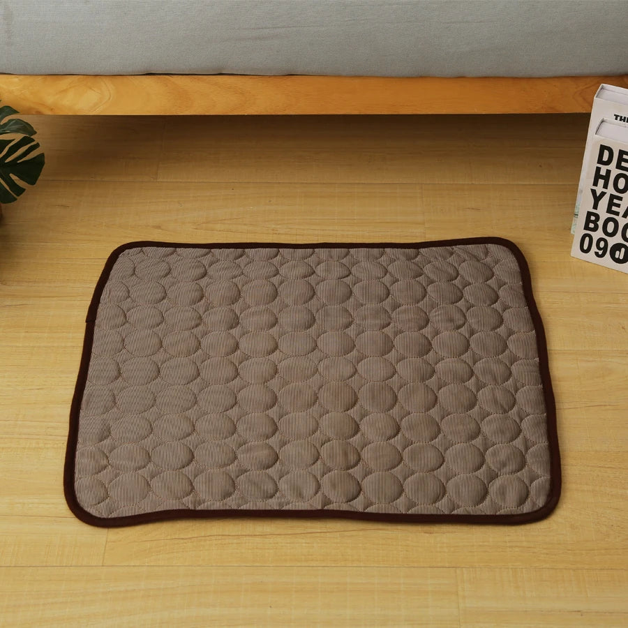Brown quilted pet cooling mat viewed from above