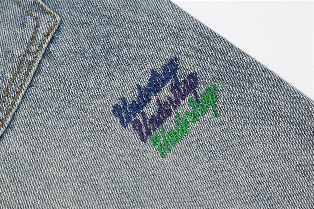 Turn heads with our brand-new line of letter embroidery jeans for men. - InspiredGrabs.com